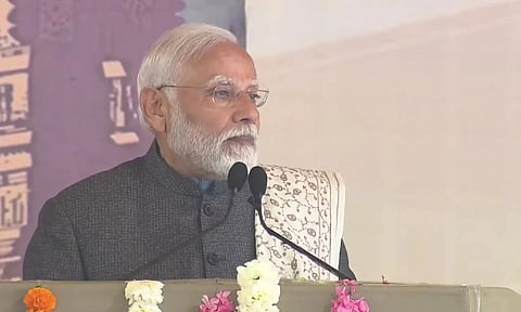 Prime Minister Narendra Modi at MoS Murugan's residence in Delhi. (ANI)
