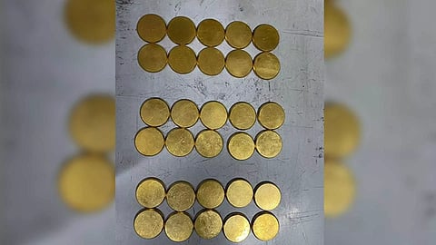 Seized gold coins (Photo credit/ AIU of Trichy airport)