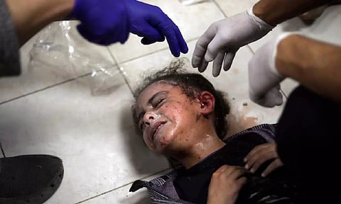 A Palestinian child wounded during the Israeli bombardment of the Gaza Strip receives treatment at the Nasser hospital in Khan Younis. (AP)