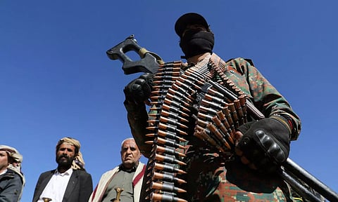 A Houthi policeman takes part in a protest against recent U.S.-led strikes on Houthi targets, near Sanaa (Reuters)