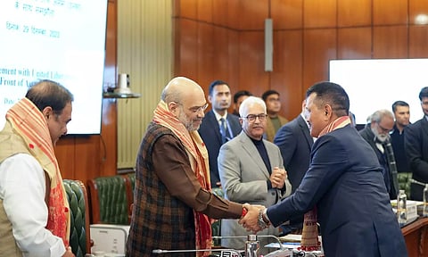 Union Home Minister Amit Shah, Assam Chief Minister Himanta Biswa Sarma and Home Secretary Ajay Kumar Bhalla with a member of ULFA during signing of a peace accord between ULFA and the central and Assam governments, in New Delhi, December 2023 (Photo: PTI)
