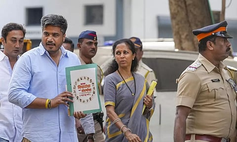NCP MLA Rohit Pawar with MP Supriya Sule arrives at the Enforcement Directorate office in Mumbai (Photo: PTI)