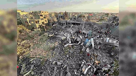 Palestinians inspect the site of an Israeli strike on a mosque (Reuters)