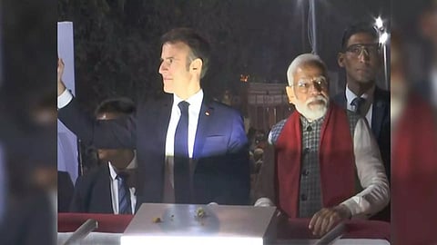 French President Emmanuel Macron and PM Modi during roadshow in Jaipur, Rajasthan. (Photo: ANI)