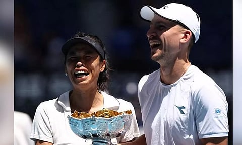 Poland's Jan Zielinski and Taiwan's Hsieh Su-wei pose with the trophy after winning their mixed doubles final match against Britain's Neal Skupski and Desirae Krawczyk of the US. (Reuters)