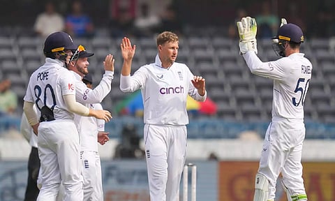 Joe Root with teammates celebrate the wicket of Jasprit Bumrah during the third day of the first test match between India and England at Rajiv Gandhi International Cricket Stadium in Hyderabad on Saturday. (PTI)
