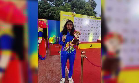 M U Joyshree poses with her bronze medal