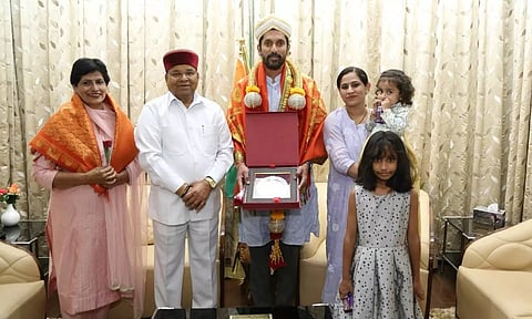Karnataka Governor Thaawarchand Gehlot felicitate sculptor Arun Yogiraj at Raj Bhavan in Bengaluru on Sunday. (ANI)