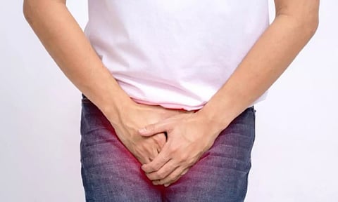 What are the symptoms of an enlarged prostate & how is it treated?