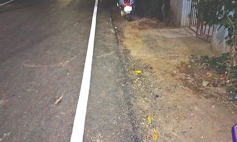 Level of tar above pavement on Srinivasan Street