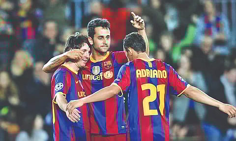 Victor Vazquez (C) celebrates a goal with Messi (L) and Adriano during his time at FC Barcelona