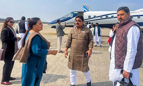 MLAs of the JMM-led alliance in Jharkhand board a flight for Hyderabd, in Ranchi. (PTI) 