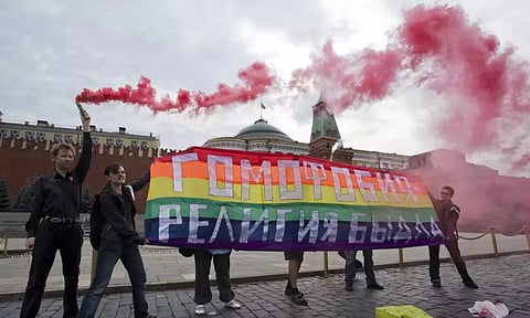 Russian laws prohibit public displays of symbols of extremist organizations, and LGBTQ+ rights advocates have warned that those displaying rainbow-colored flags or other items might be targeted by the authorities. (AP)