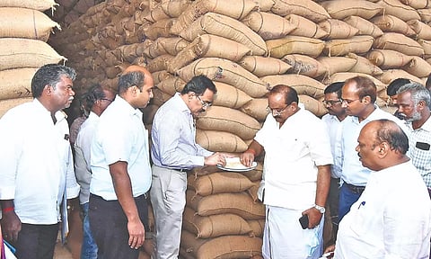 Food Minister R Sakkarapani inspecting stocks at a warehouse in Thanjavur on Tuesday