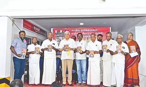 Prakash Karat and other leaders at the book release.