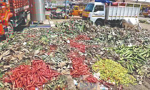 Unsold vegetables dumped inside the market