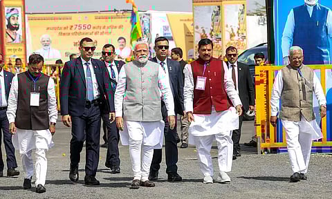 PM Modi at the dedication and foundation stone laying ceremony of various development projects during 'Janjatiya Sammelan' in Jhabua on Sunday. (PTI)