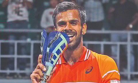Sumit Nagal with the ATP trophy