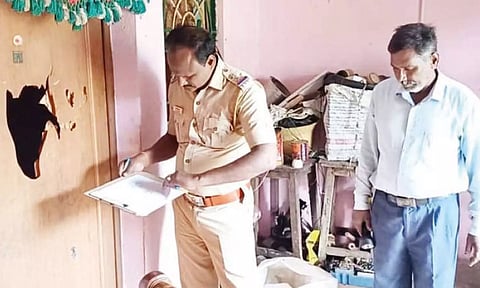 Paradarami police inspecting the damage