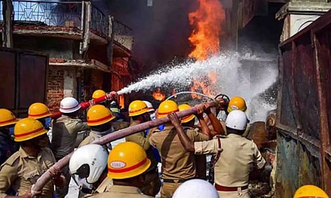 Firemen setting out the fire at the factory (PTI)