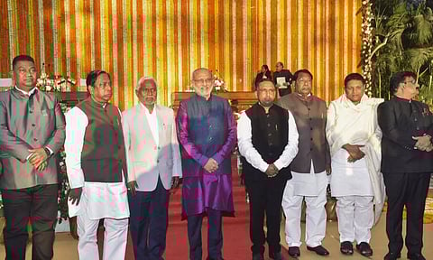 Jharkhand Guv CP Radhakrishnan and CM Champai Soren pose for photos with the newly sworn-in State Cabinet Ministers at the Raj Bhavan in Ranchi on Feb 16. (PTI)