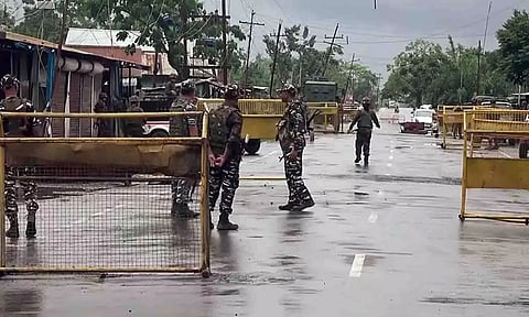 Police personnel fire tear gas at protesters in Imphal. (PTI)