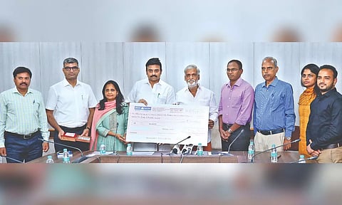 CMDA handed over a cheque of Rs 5 crore to Forest Department Minister M Mathiventhan to create an urban forest in Siruseri, on Friday.