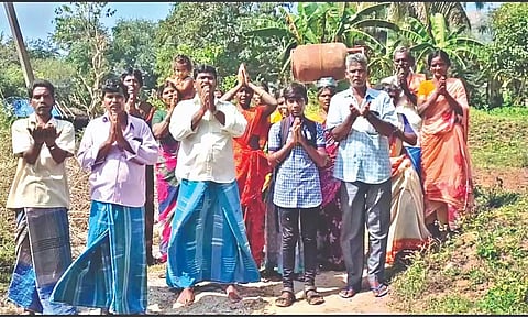 Periannanpatti residents, one seen with a cylinder on head, thank officials (not seen) who came to provide polio drops