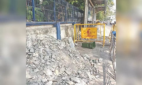 Debris dumped on footpath of EVR Periyar Salai