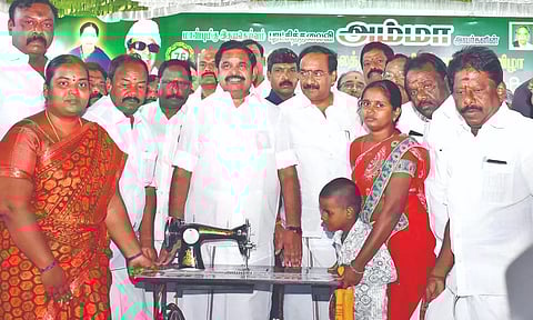 AIADMK general secretary Edappadi K Palaniswami presenting welfare aid to a beneficiary at a party function in Salem on Sunday