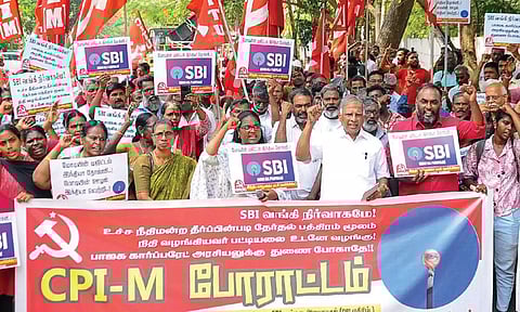CPM workers stage protest against State Bank of India’s delaying tactics in disclosing the electoral bond details to Supreme Court, in Nungambakkam, on Wednesday