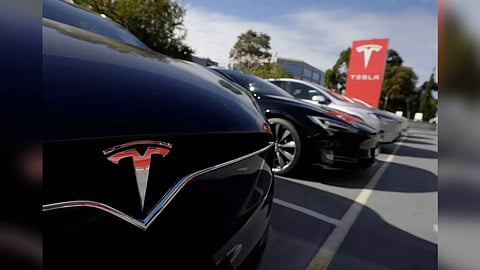 A Tesla Model X is photographed alongside a Model S at a Tesla electric car dealership in Sydney (Reuters)