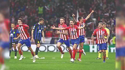 Atletico Madrid’s players break into celebration after winning penalty shootout