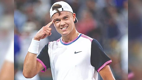 Holger Rune reacts after winning a set against Taylor Fritz