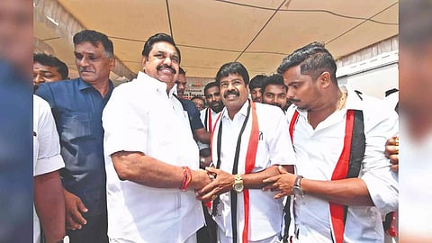 OPS supporters returning to the AIADMK in the presence of general secretary Edappadi K Palaniswami in Chennai on Friday