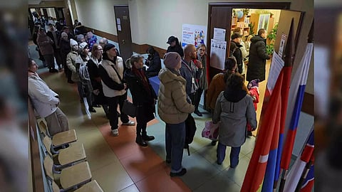 People stand in a line to enter a polling station on the final day of presidential election (Photo:Reuters)