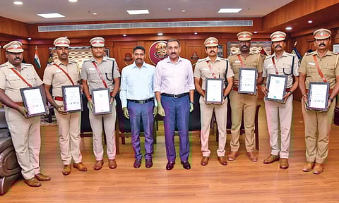 Commissioner of Police Sandeep Rai Rathore with the police personnel of the four stations in Adyar police district with the ISO certification