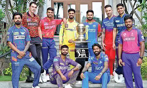 All the 10 IPL captains pose with the trophy on the eve of the tournament