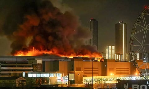 A massive blaze is seen over the Crocus City Hall on the western edge of Moscow, Russia. (AP) 