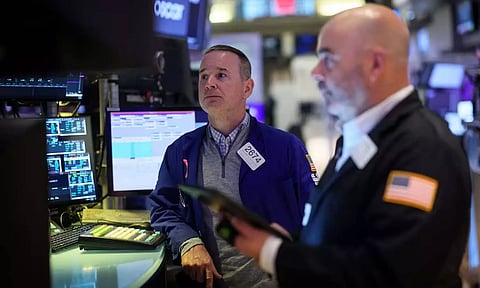 Traders work on the floor at the New York Stock Exchange (Reuters)