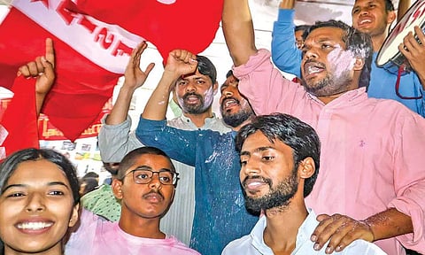 Newly elected JNUSU president Dhananjay (pink kurta) with other AISA members and supporters celebrate his win