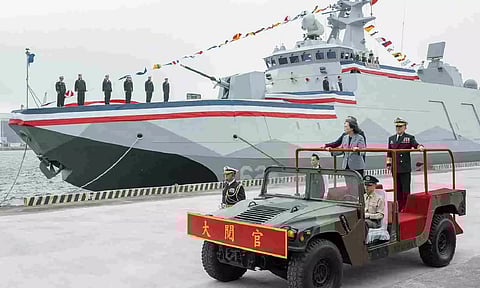 Taiwan's President Tsai Ing-wen inspects the commissioning of two new navy ships in the northern Taiwan port (AP)