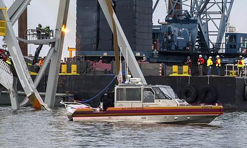 29-foot response boat-small crew observes the collapsed Francis Scott Key Bridge (AP)