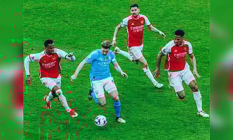 Manchester City and Arsenal in action. (Manchester City Twitter)