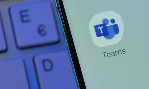 Microsoft Teams app is seen on the smartphone placed on the keyboard in this illustration taken
