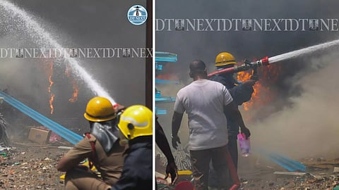 Visuals of firefighters drousing fire at a plastic scrap storage facility in Madipakkam, Chennai. (Image: Justin George)