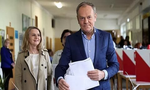 Polish PM Donald Tusk casts his vote next to his wife Malgorzata in Sopot, Poland (Photo/Reuters)