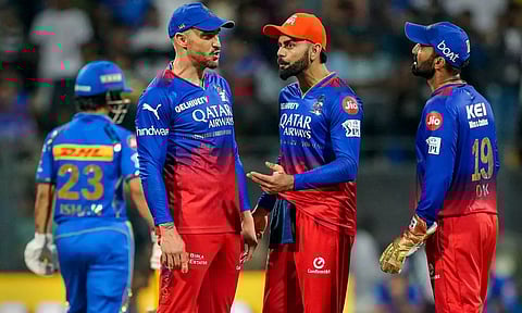 RCB players discussing during the game (PTI)