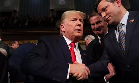 U.S. President Donald Trump is greeted by Rep. Mike Johnson (R-LA) as he arrives to deliver his State of the Union address to a joint session of the U.S. Congress in the House Chamber of the U.S. Capitol (Reuters)