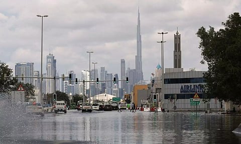 A general view of flood water caused by heavy rains, with the Burj Khalifa tower visible in the background (Reuters)